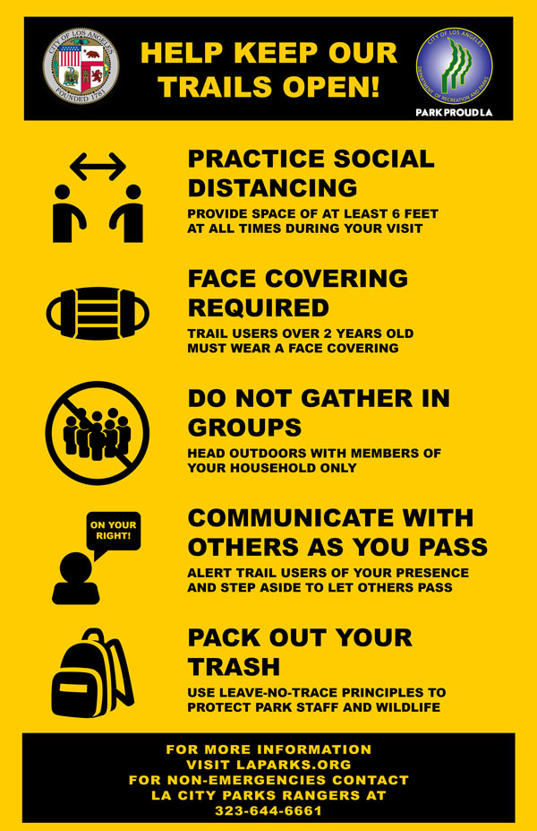 A sign showing rules for safe hiking during COVID