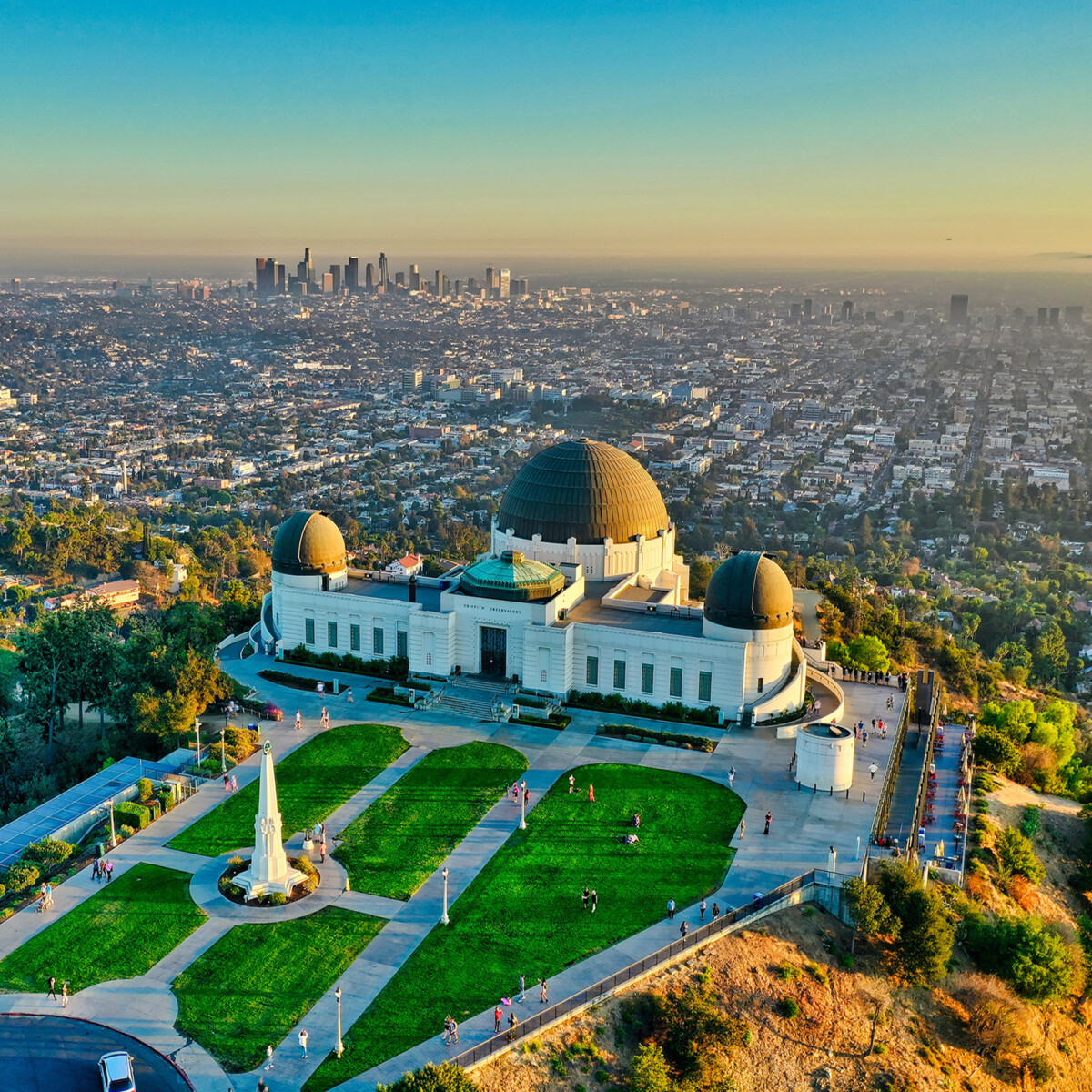 Overhead view of Griffith Observatory with Los Angeles in the background during the day.