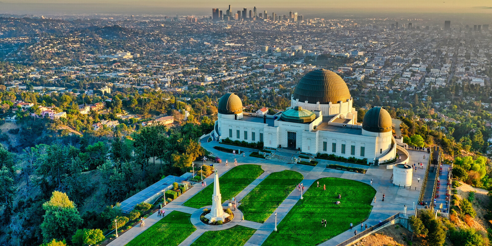 Overhead view of Griffith Observatory with Los Angeles in the background during the day.