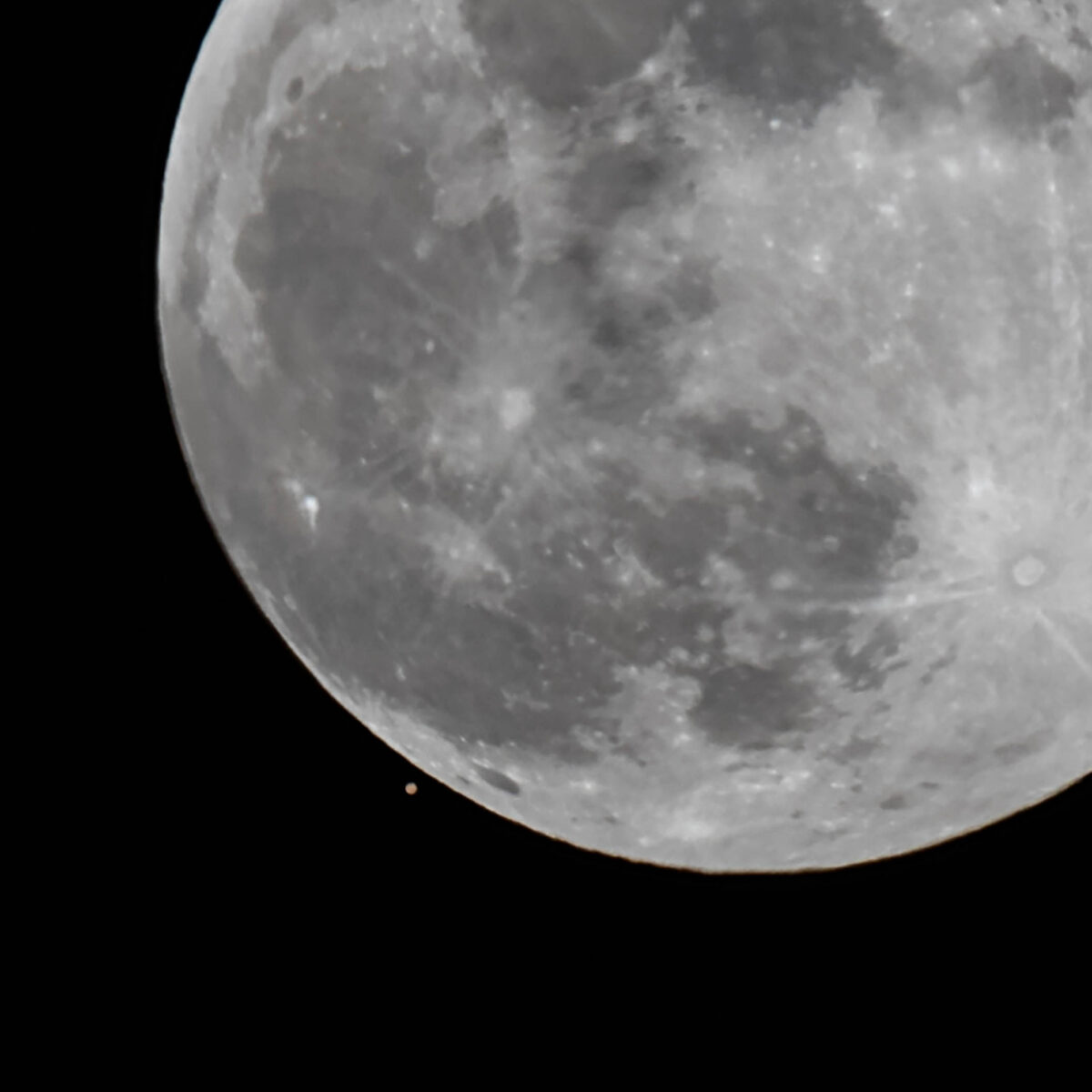 Closeup of Mars being almost overtaken by the Moon.