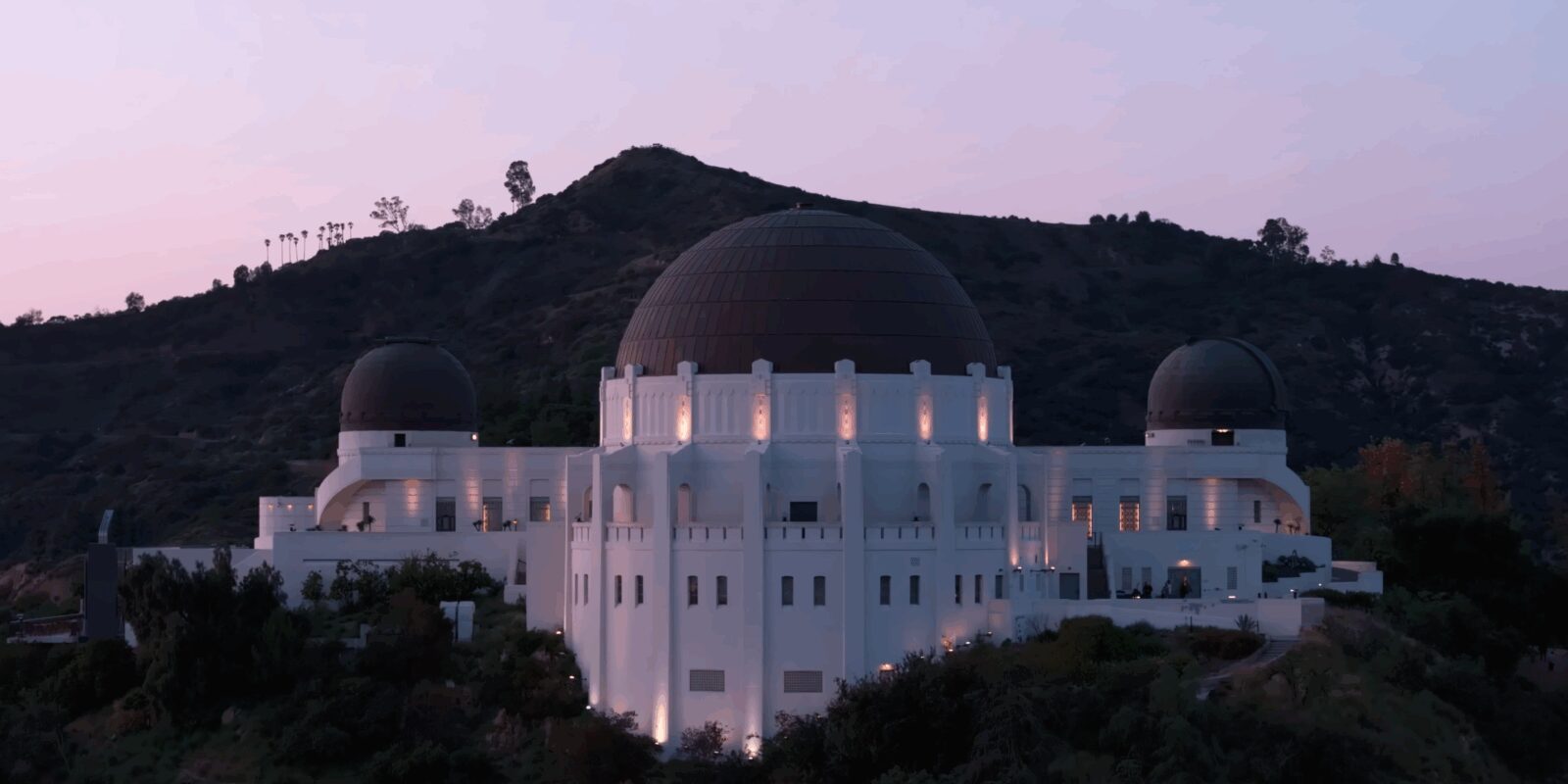 Drone shot of Griffith Observatory looking north at twilight.